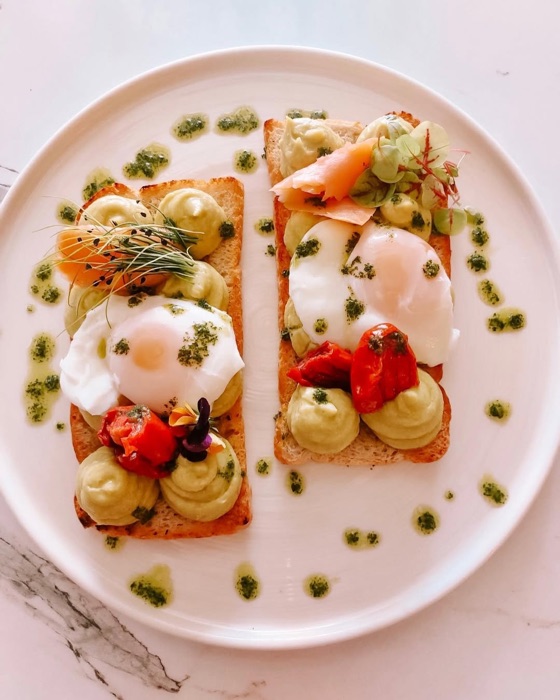 Poached eggs with halloumi and salad at OIKOS